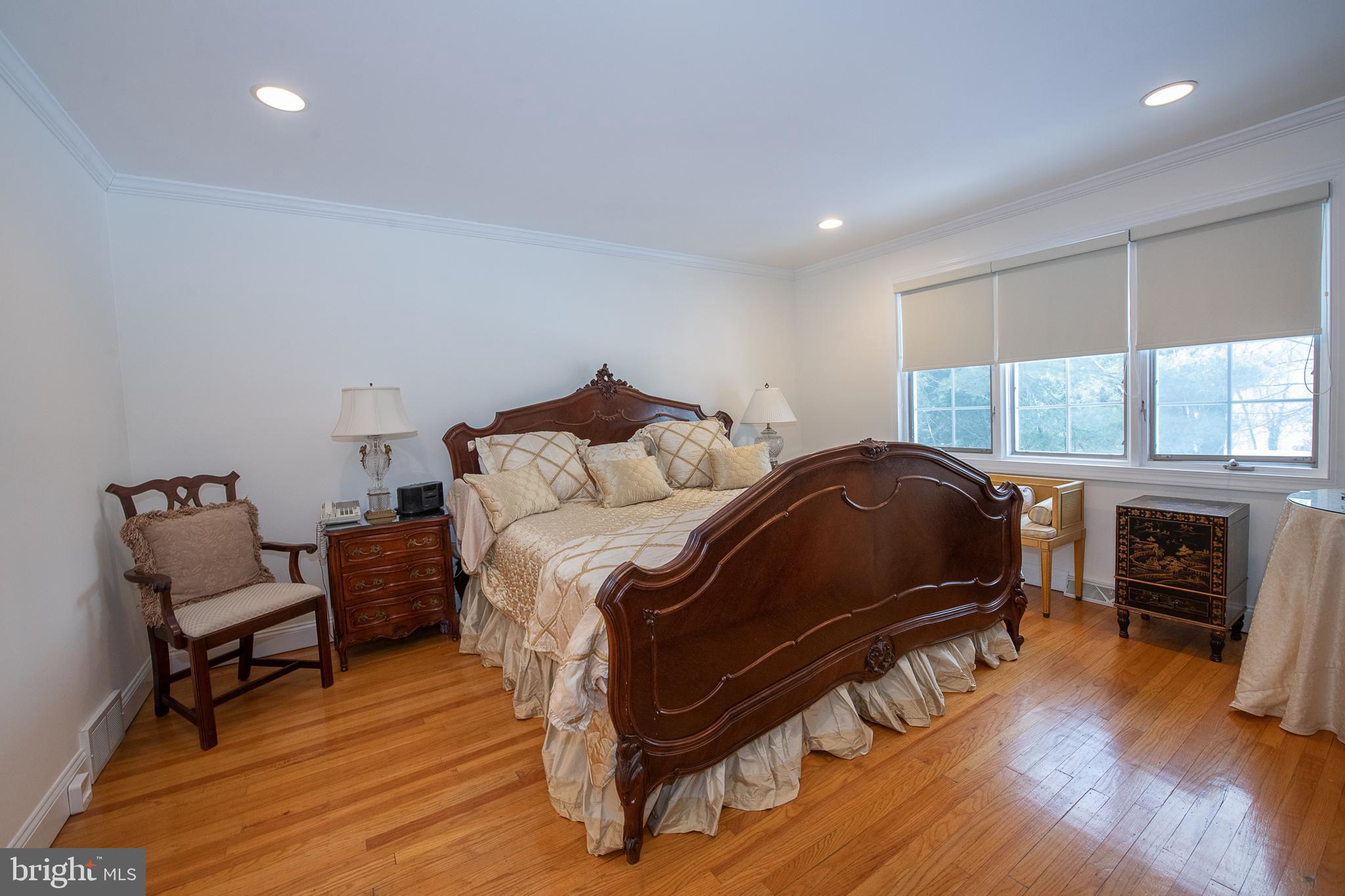2209 North Stone Ridge Lane Villanova, PA 19085 - Photo 16 of 29 a bedroom with a bed and a fireplace