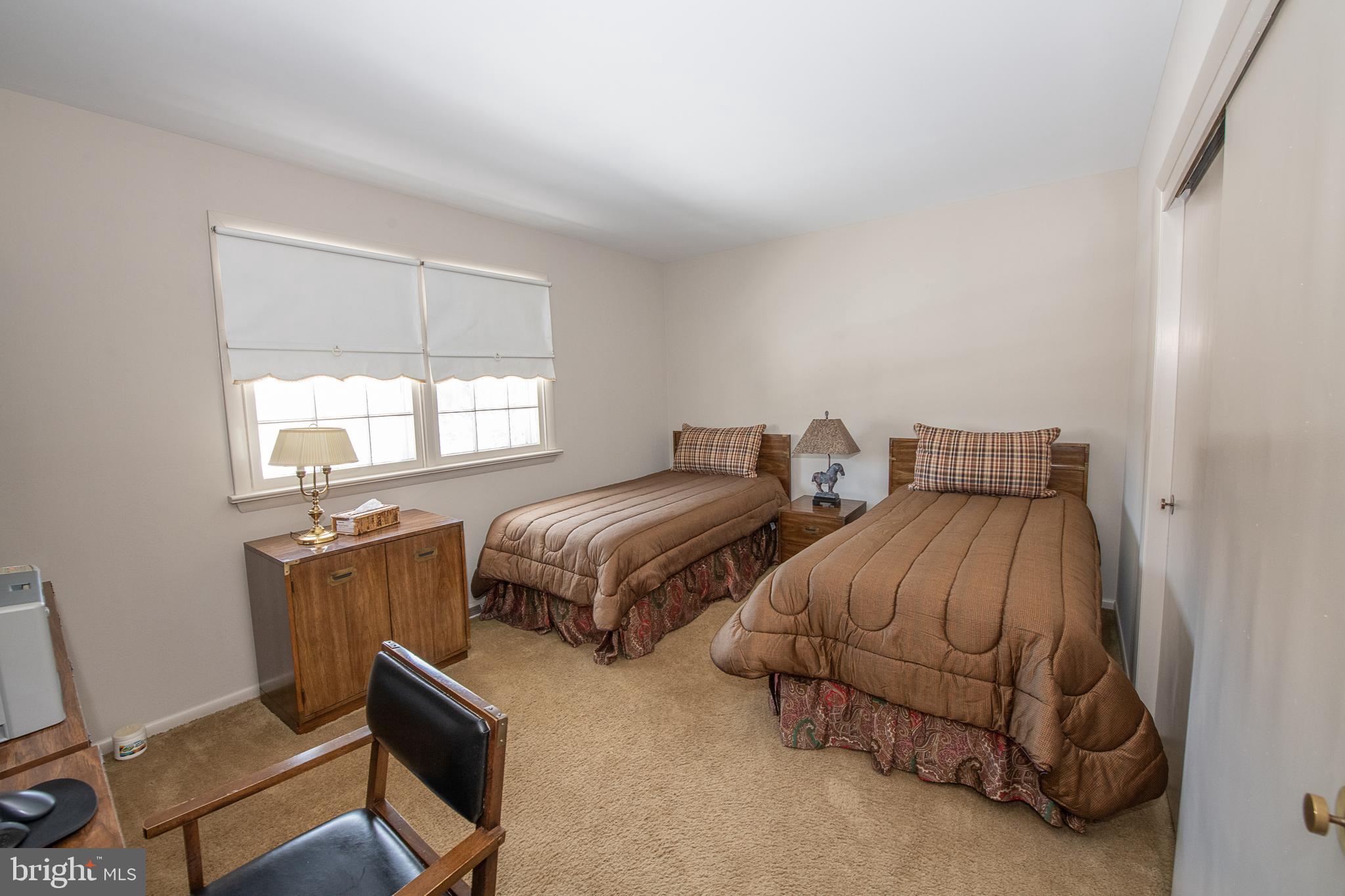 2209 North Stone Ridge Lane Villanova, PA 19085 - Photo 19 of 29 a bedroom with two beds and a window