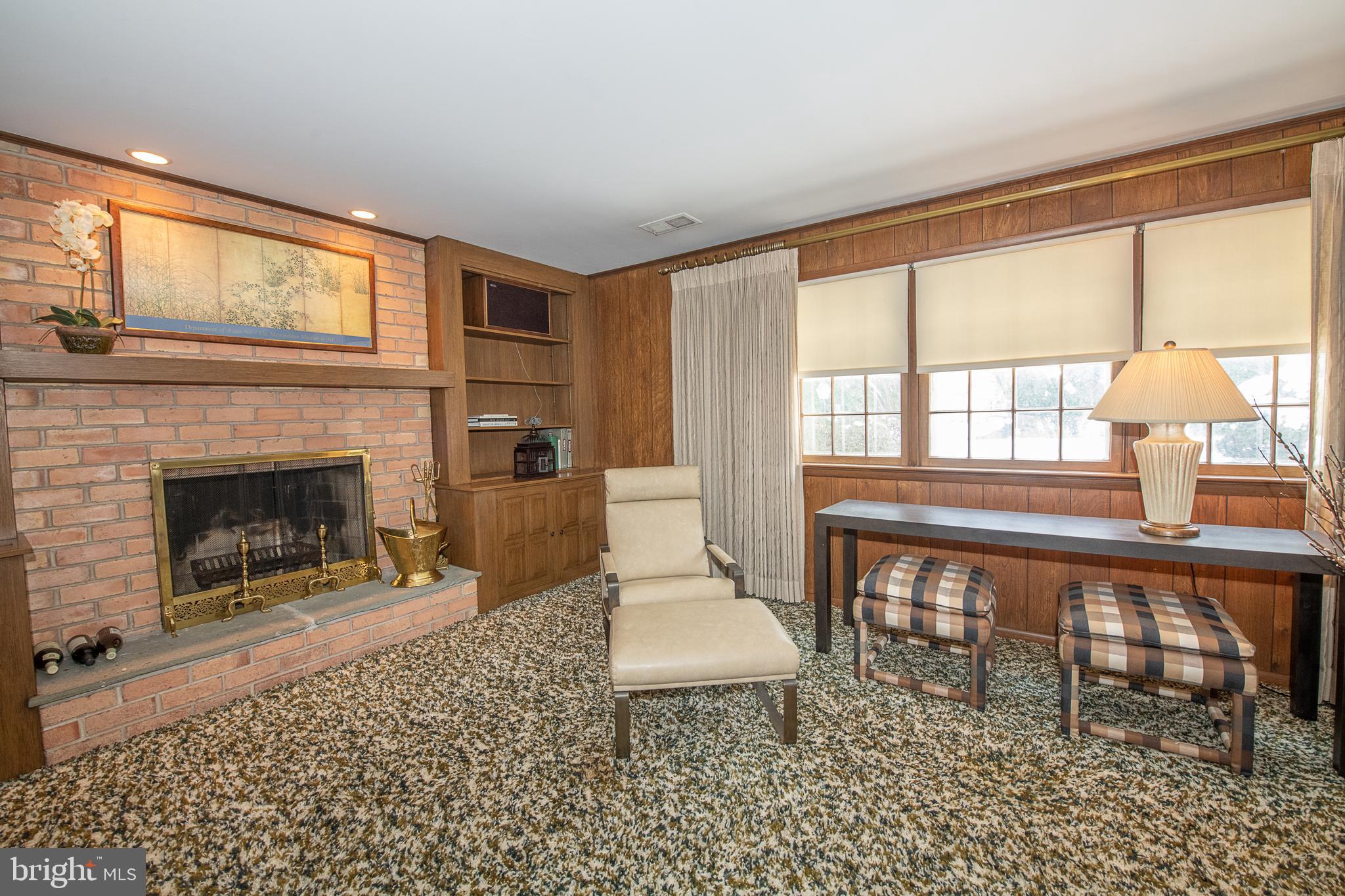 2209 North Stone Ridge Lane Villanova, PA 19085 - Photo 21 of 29 a living room with furniture a window and a fireplace