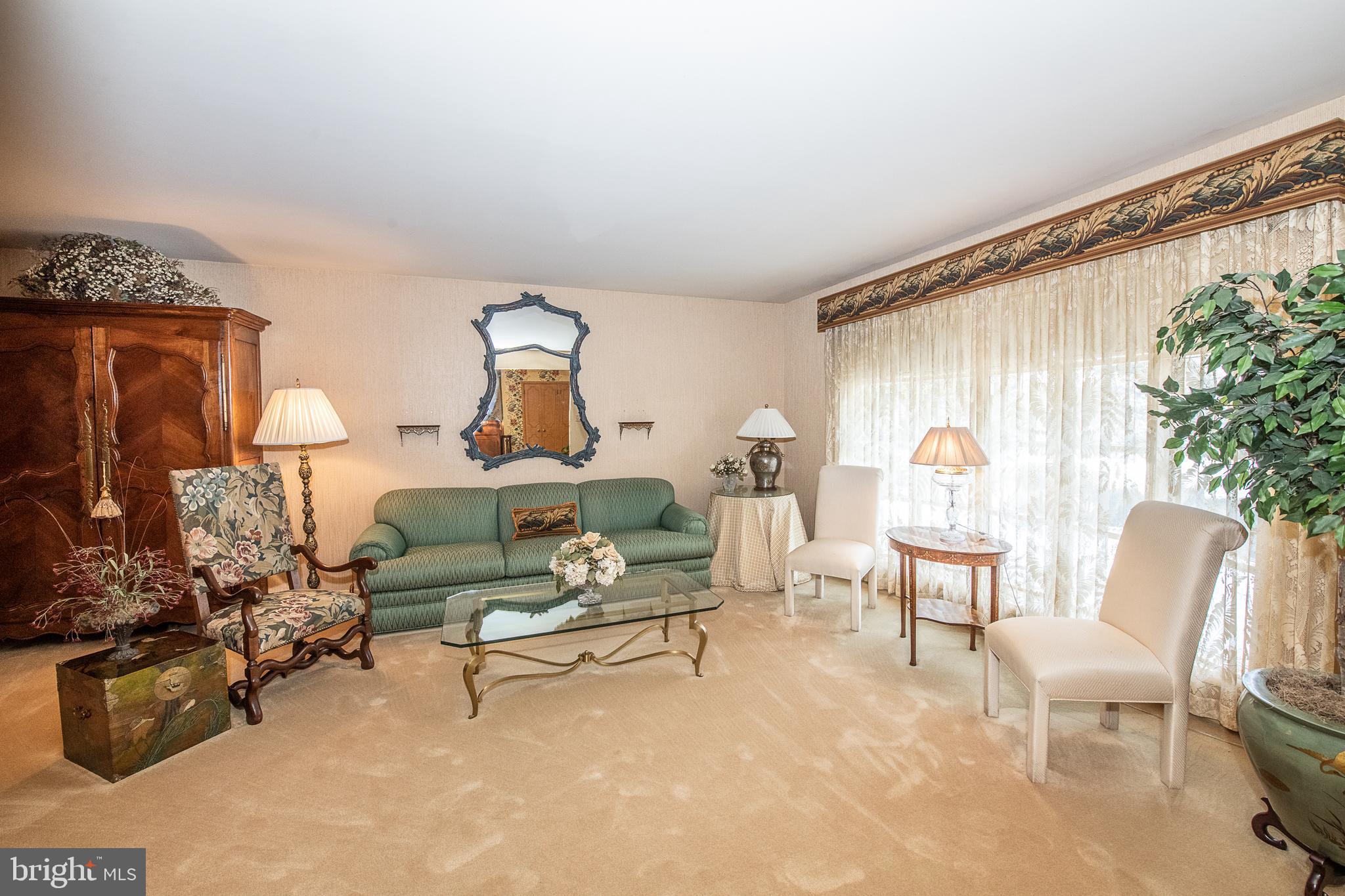 2209 North Stone Ridge Lane Villanova, PA 19085 - Photo 6 of 29 a living room with furniture and a painting on the wall