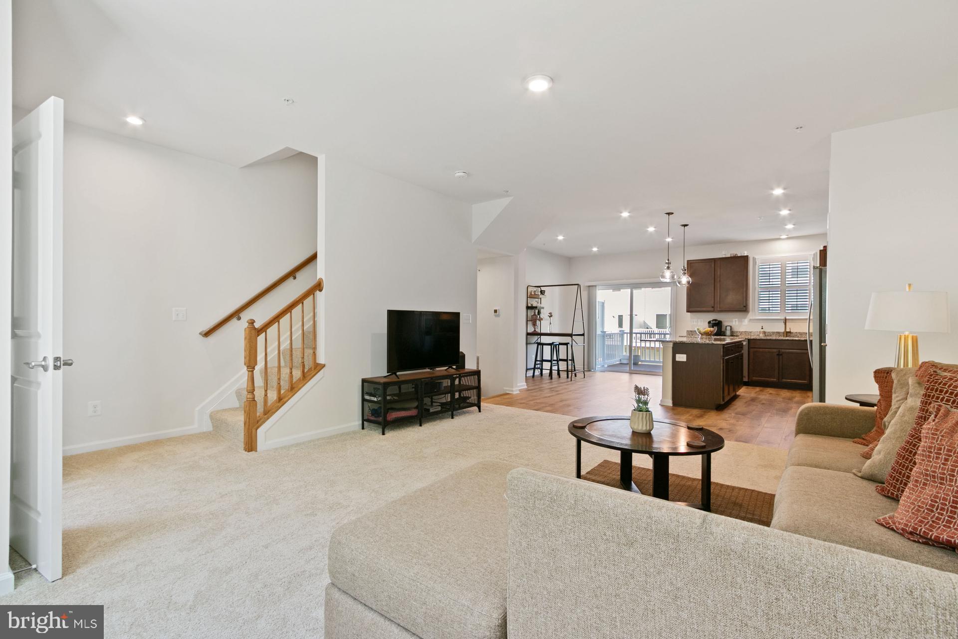 340 Shipyard Drive Cambridge, MD 21613 - Photo 21 of 35 a living room with furniture and a flat screen tv