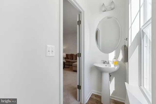 a front view of a house with wooden floor door and a bathroom