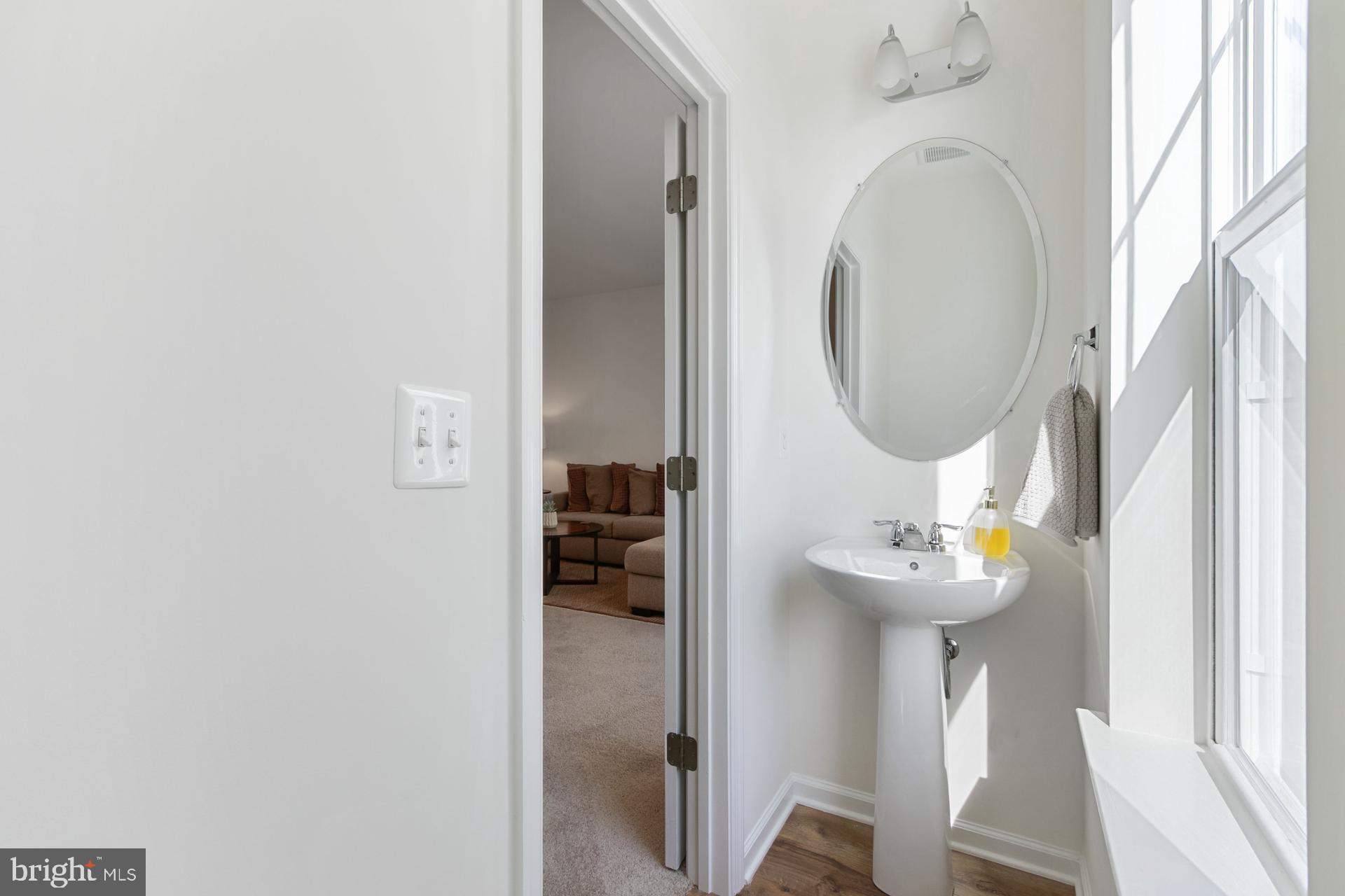 340 Shipyard Drive Cambridge, MD 21613 - Photo 23 of 35 a front view of a house with wooden floor door and a bathroom
