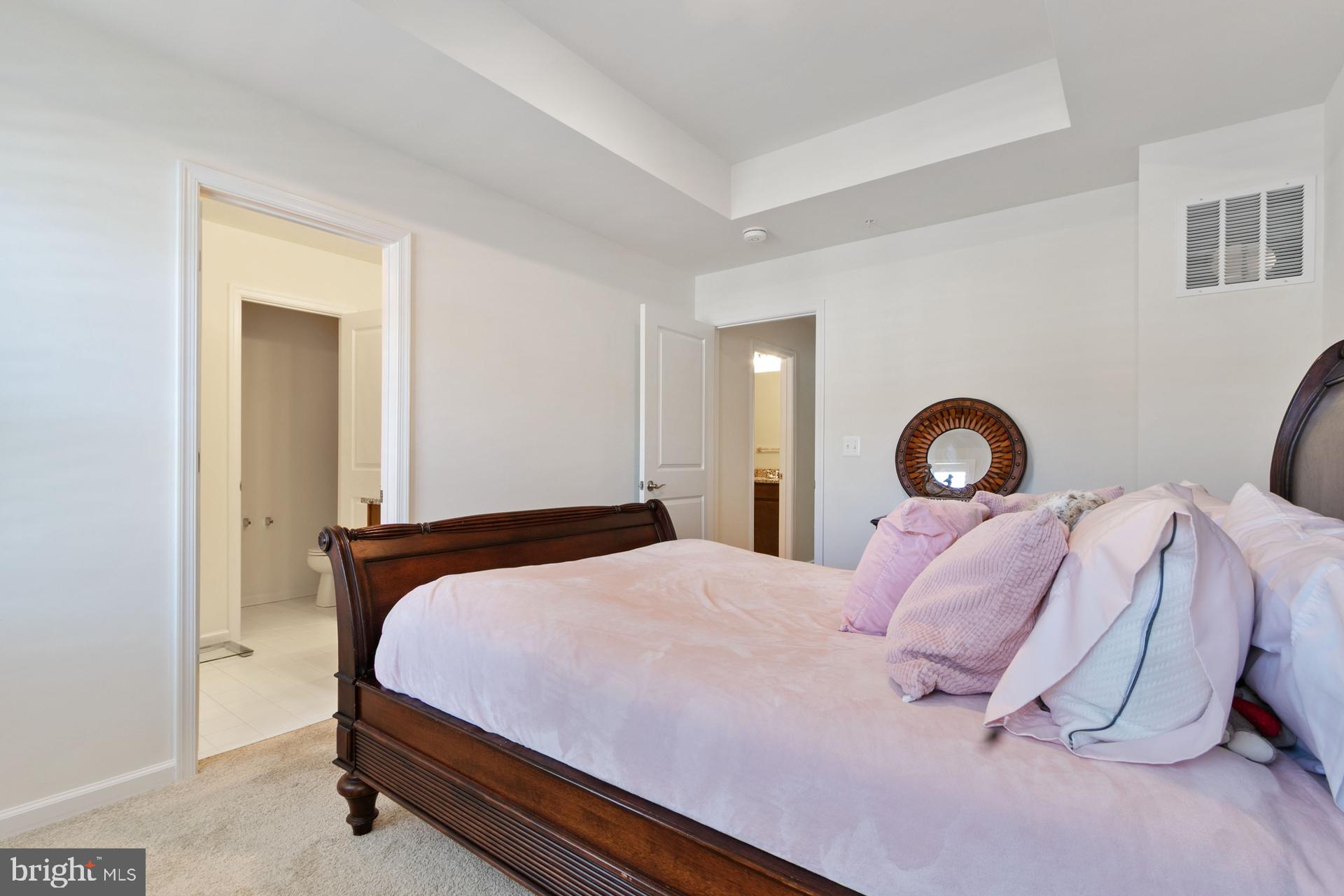 340 Shipyard Drive Cambridge, MD 21613 - Photo 25 of 35 a bedroom with a bed and a lamp