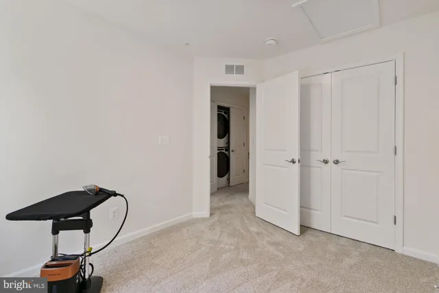 a room with gym equipment and a window