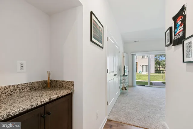 a view of hallway with livingroom