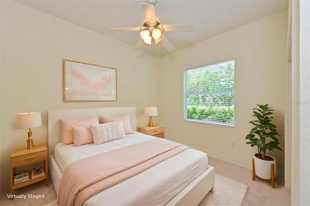 10622 Conch Shell Terrace Bradenton, FL 34212 - Photo 40 of 69 a bedroom with a bed and a potted plant