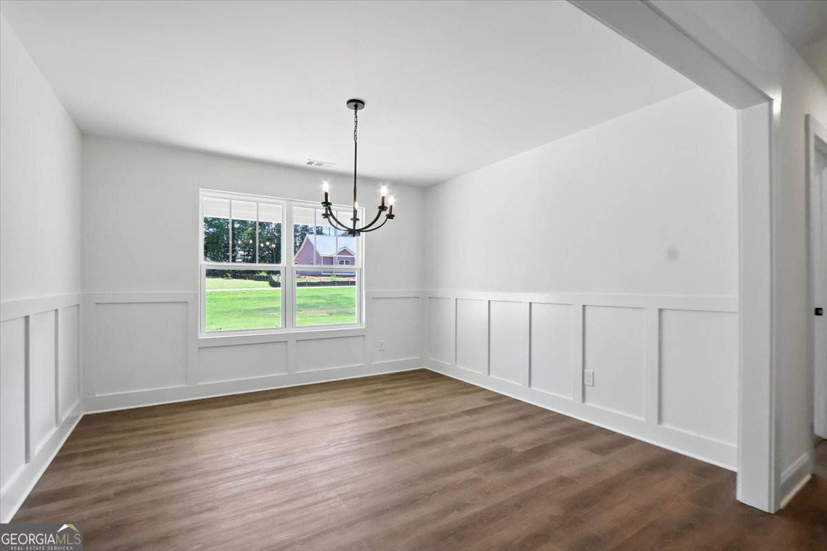 166 Rachel Lane Hartwell, GA 30643 - Photo 18 of 51 a view of empty room with wooden floor and fan