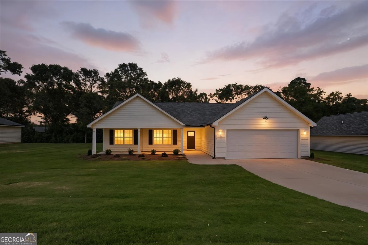 166 Rachel Lane Hartwell, GA 30643 - Photo 51 of 51 a front view of a house with a yard and garage