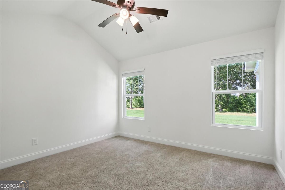 166 Rachel Lane Hartwell, GA 30643 - Photo 28 of 51 an empty room with a window and a fan