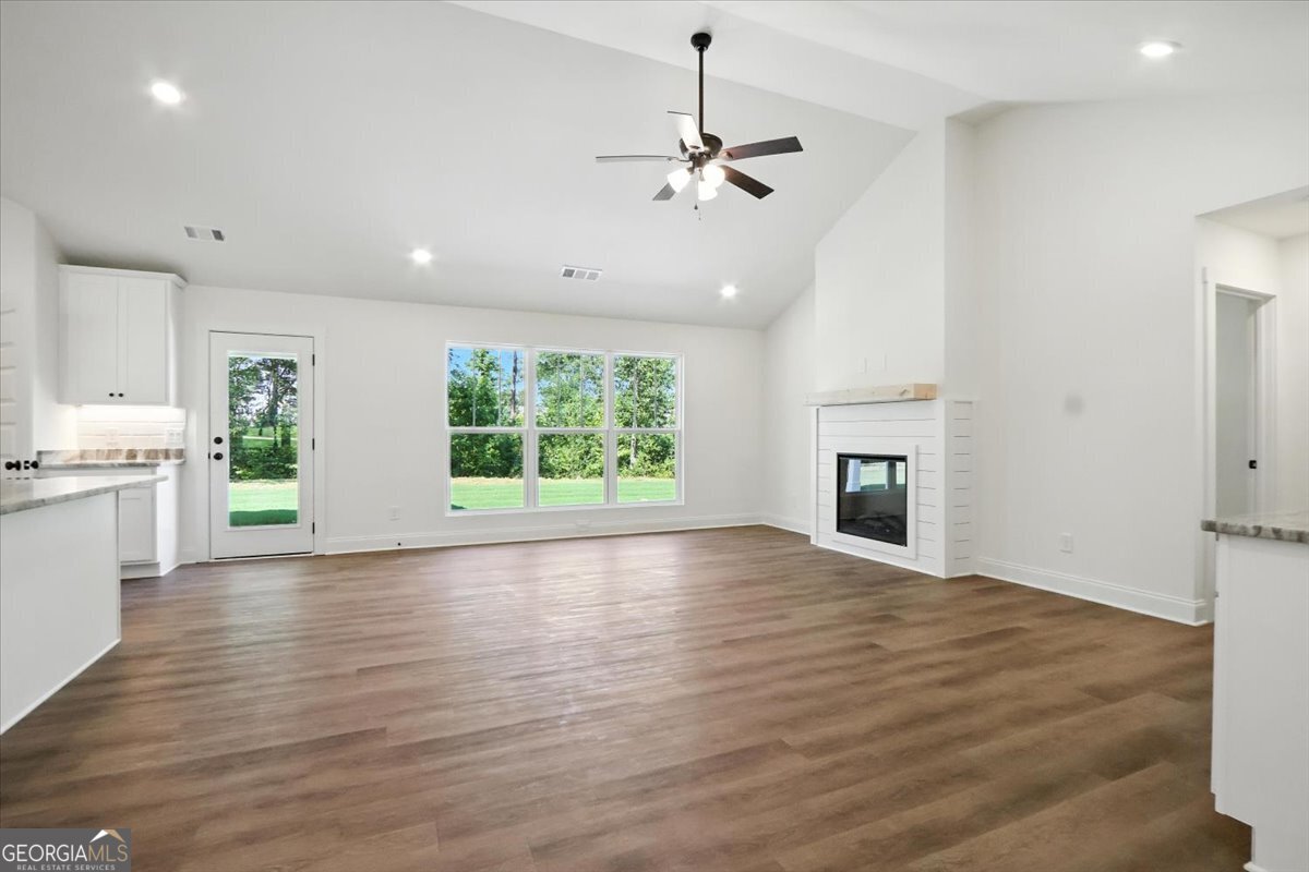 166 Rachel Lane Hartwell, GA 30643 - Photo 3 of 51 a view of an empty room with window and wooden floor