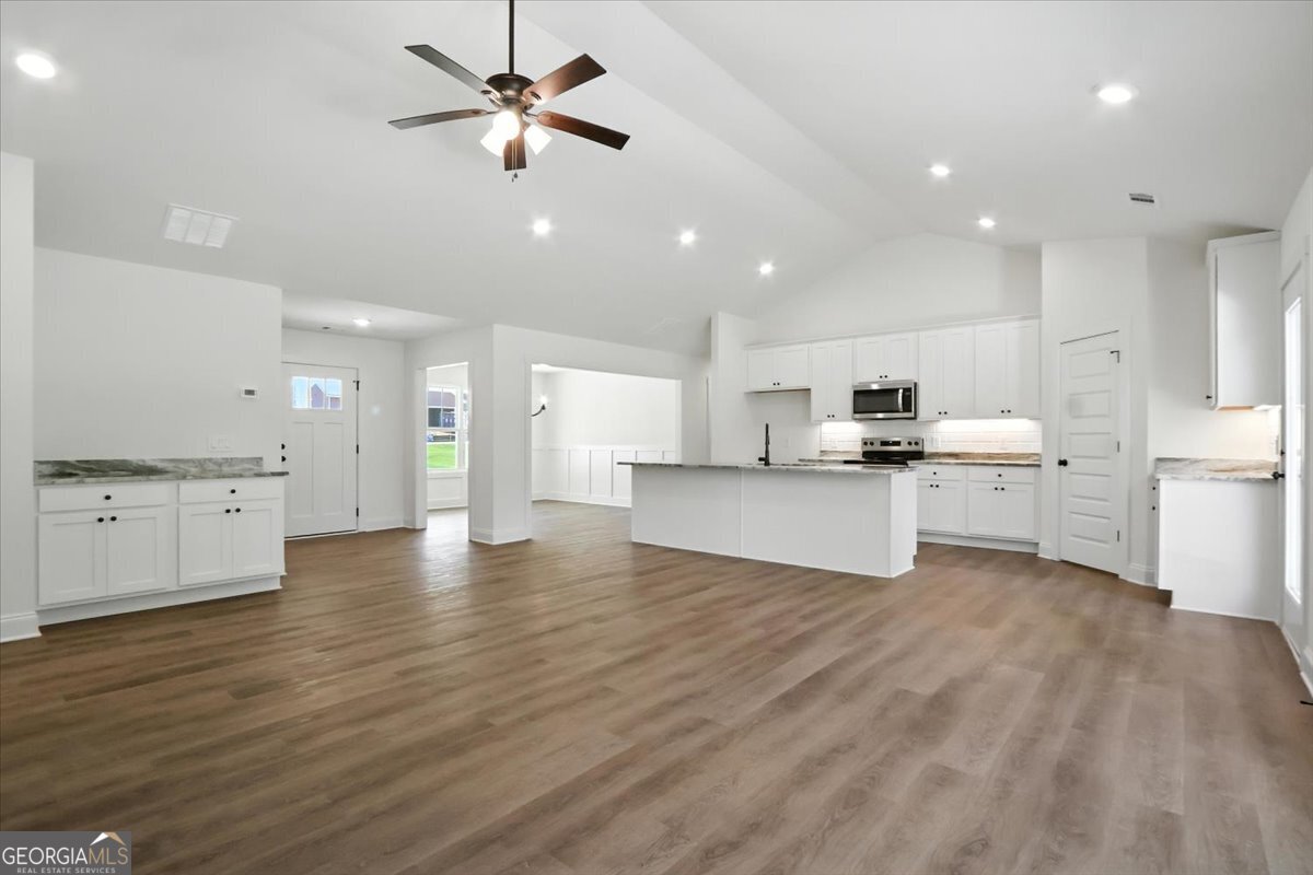166 Rachel Lane Hartwell, GA 30643 - Photo 7 of 51 a view of kitchen with wooden floor and window