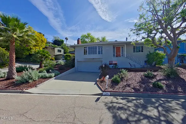 a view of a house with a yard