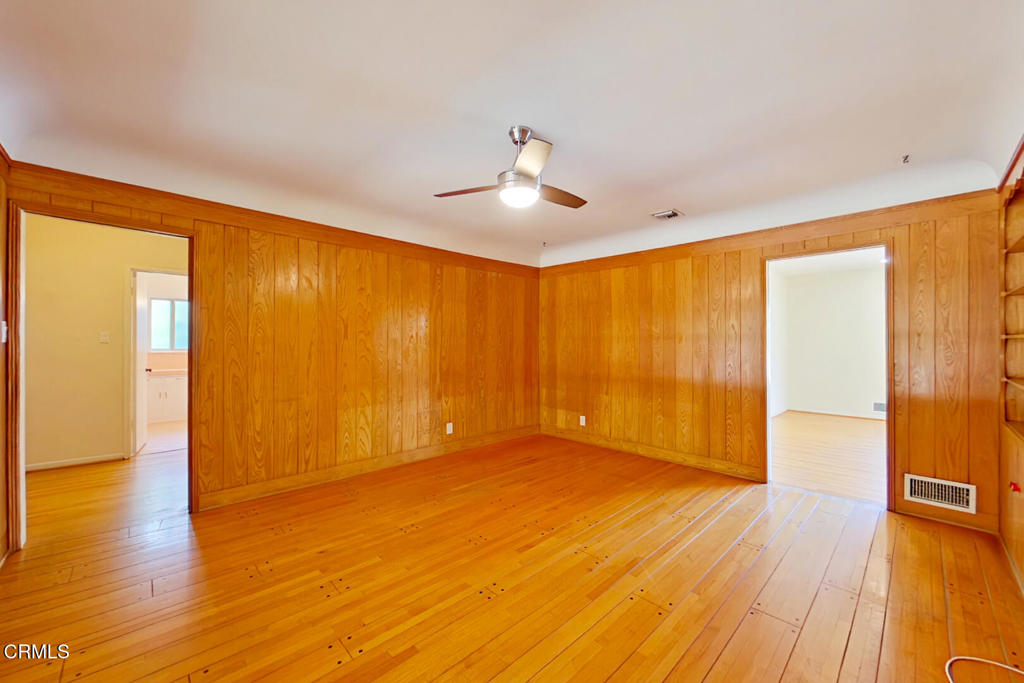 1462 Glengarry Road Pasadena, CA 91105 - Photo 20 of 57 a view of an empty room with wooden floor and a window