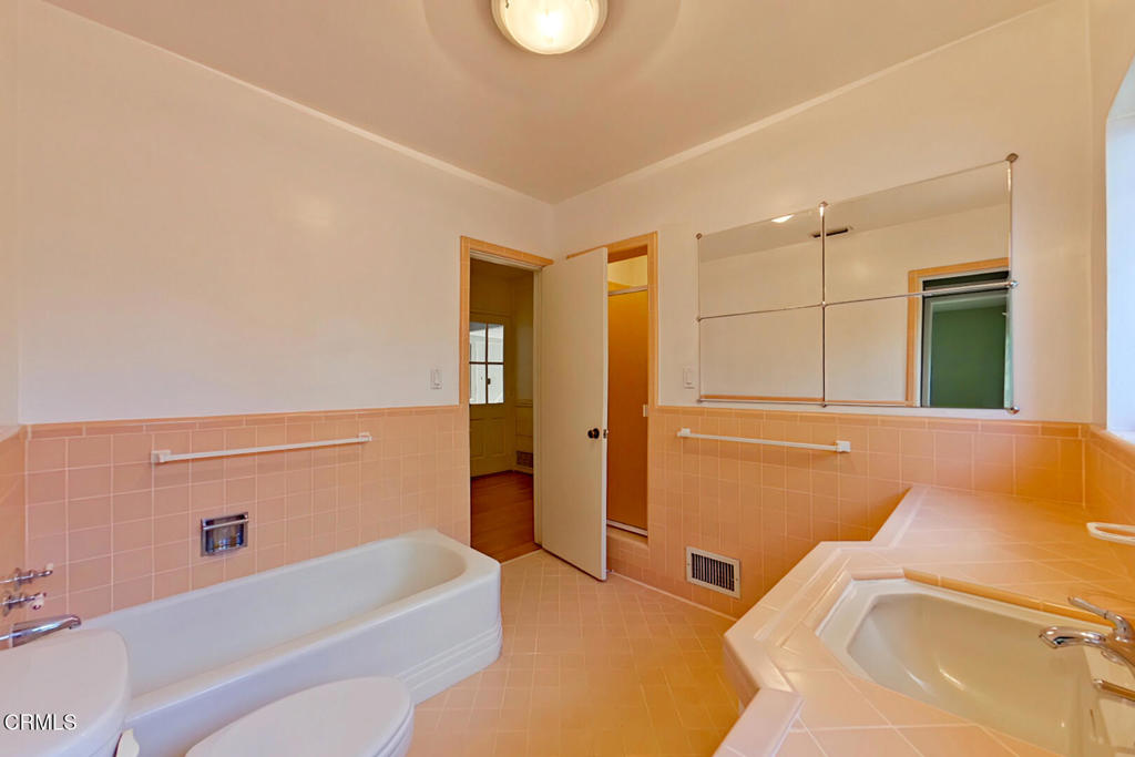 1462 Glengarry Road Pasadena, CA 91105 - Photo 25 of 57 a bathroom with a bathtub and shower