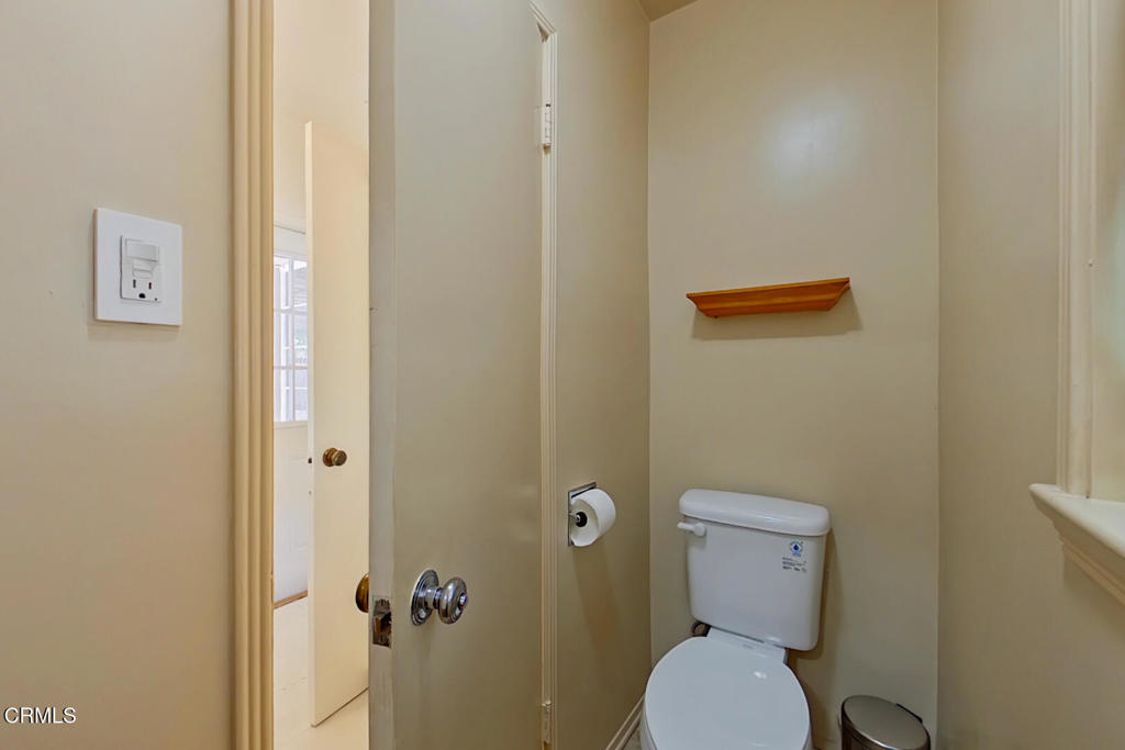 1462 Glengarry Road Pasadena, CA 91105 - Photo 34 of 57 a white toilet sitting next to a bathroom sink