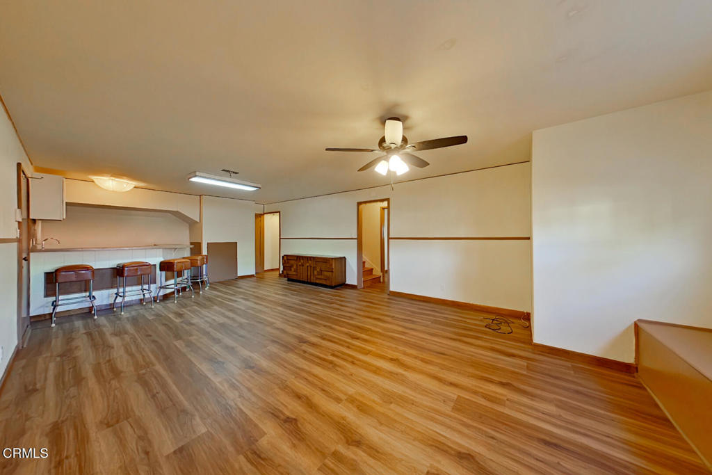 1462 Glengarry Road Pasadena, CA 91105 - Photo 42 of 57 a view of a livingroom with wooden floor and a ceiling fan