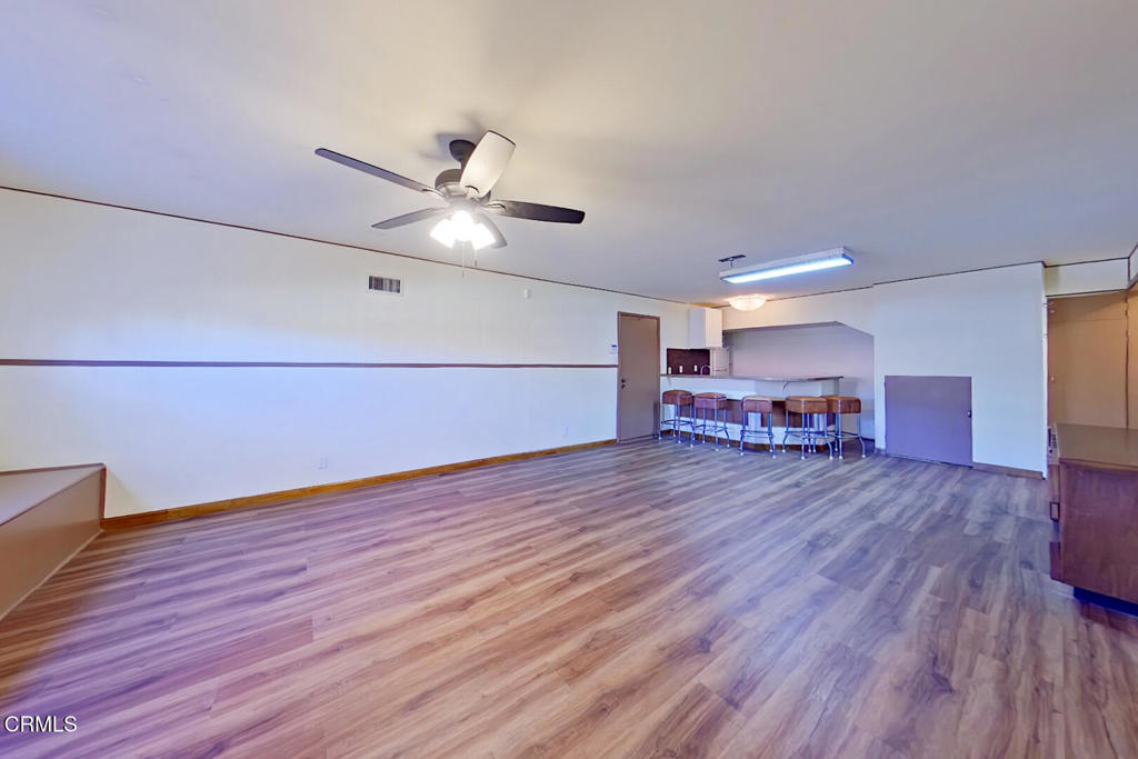 1462 Glengarry Road Pasadena, CA 91105 - Photo 43 of 57 a living room with furniture and a wooden floor