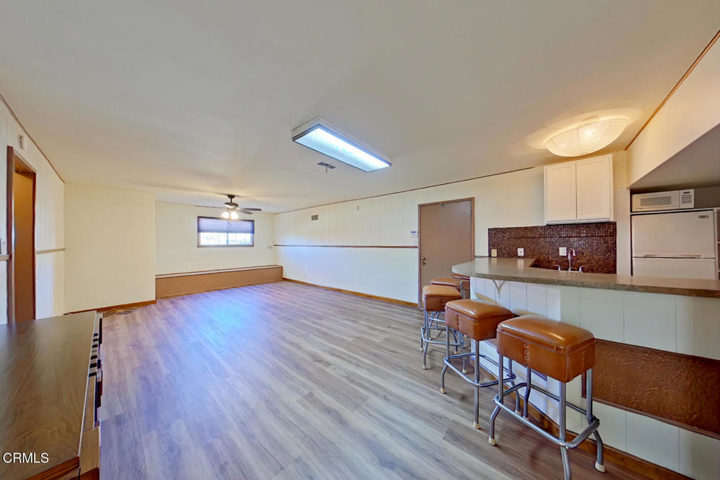 1462 Glengarry Road Pasadena, CA 91105 - Photo 44 of 57 a living room with furniture and a wooden floor