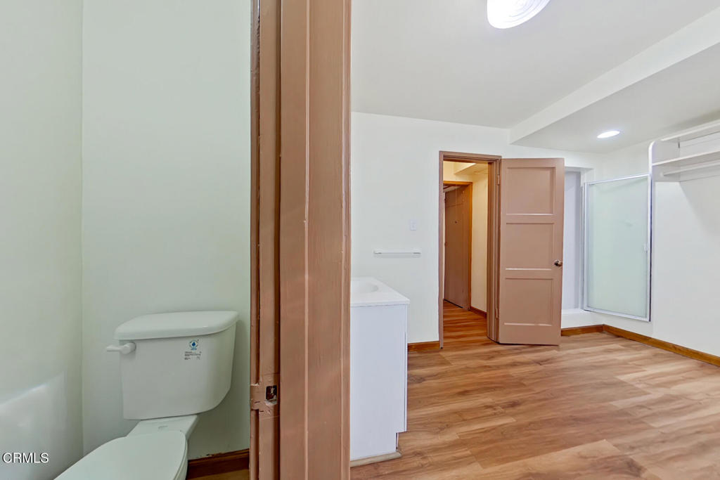 1462 Glengarry Road Pasadena, CA 91105 - Photo 46 of 57 a view of bathroom with a toilet a sink and a mirror