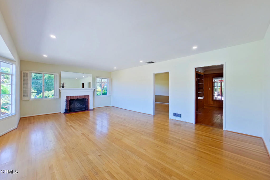 1462 Glengarry Road Pasadena, CA 91105 - Photo 5 of 57 a view of an empty room with window and wooden floor