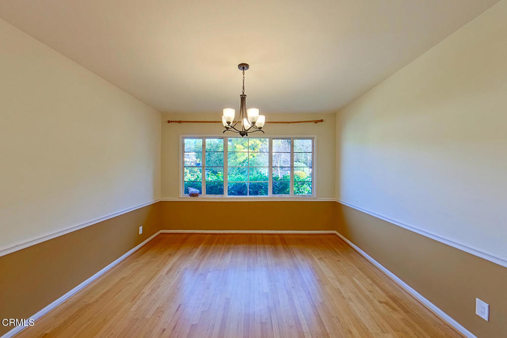 1462 Glengarry Road Pasadena, CA 91105 - Photo 9 of 57 a window in an empty room with wooden floor