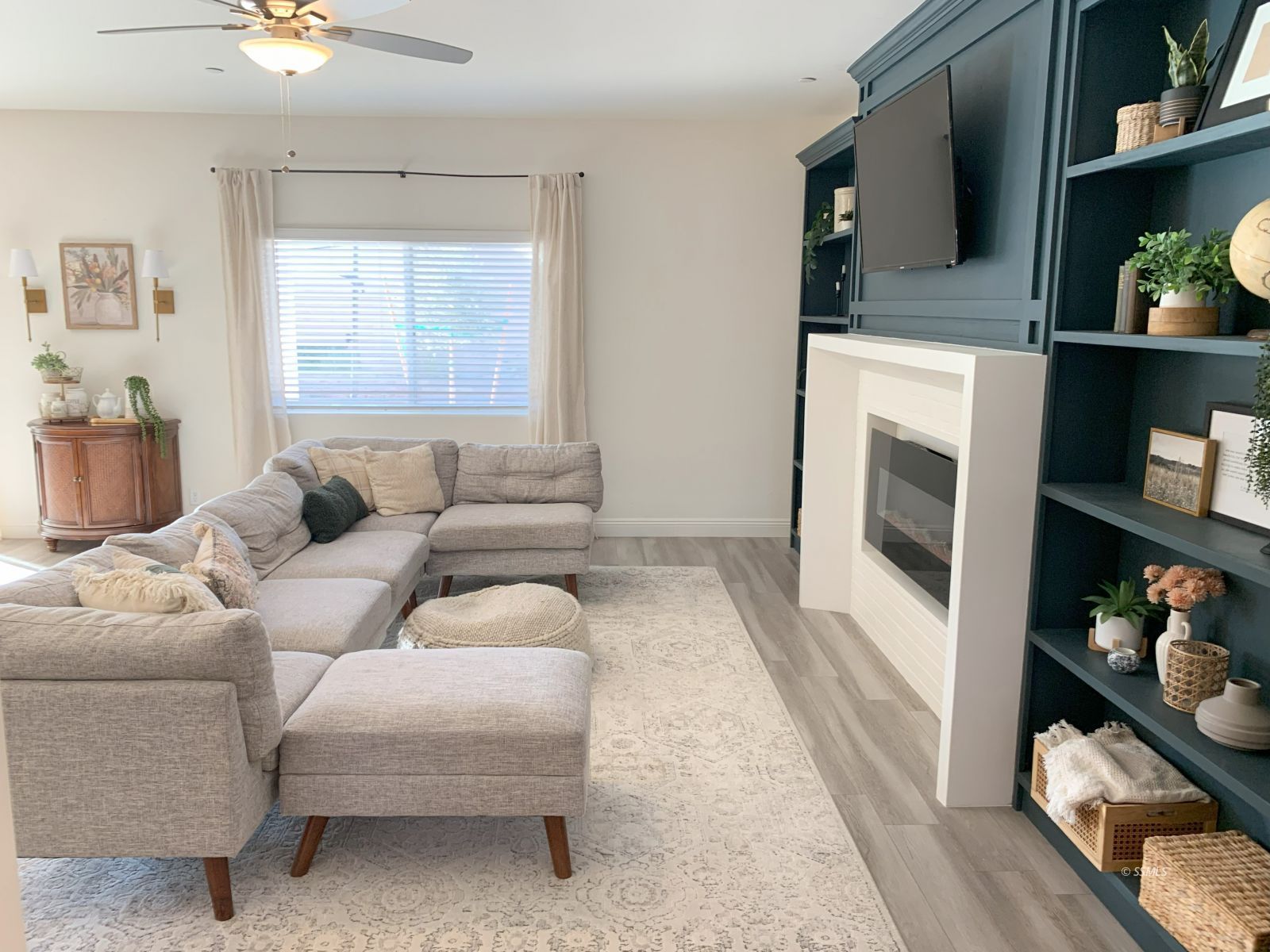 419 Thomas Street Ridgecrest, CA 93555 - Photo 13 of 32 a living room with furniture and a fireplace