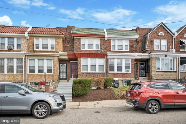 a car parked in front of a house