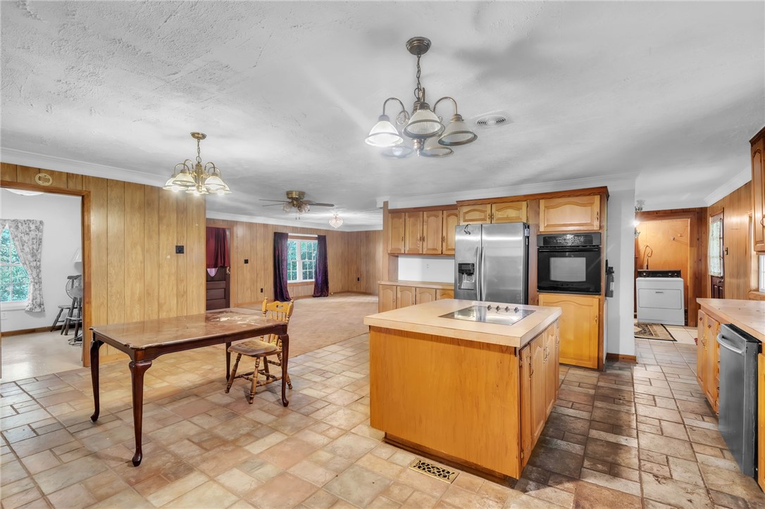 602 Harper Road Pendleton, SC 29670 - Photo 10 of 32 A classic kitchen with durable tile flooring and abundant wood cabinetry awaits your culinary touch.