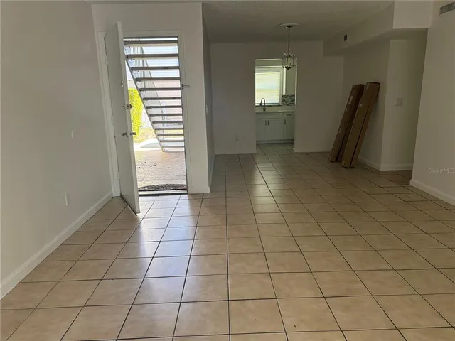 a view of an empty room with a window