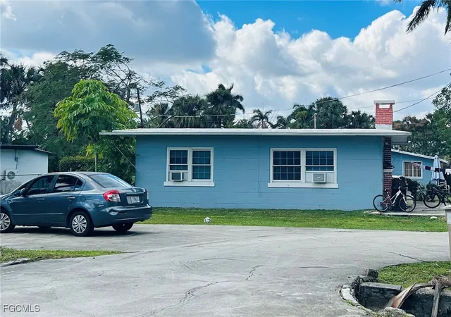 a view of a car parked in front of a house