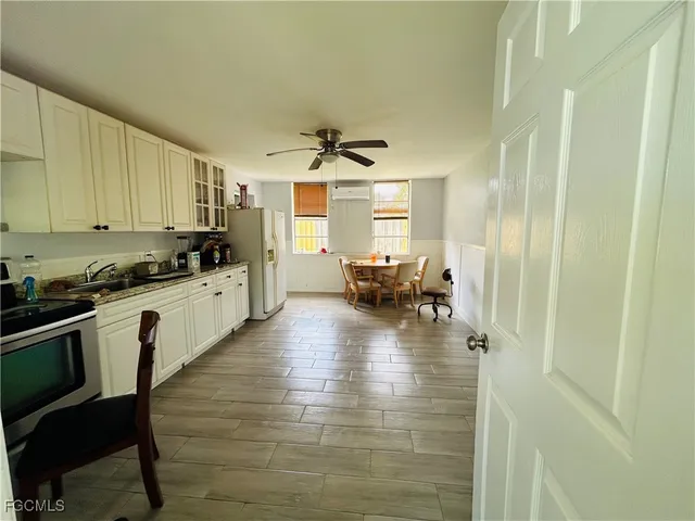 a kitchen with sink and cabinets