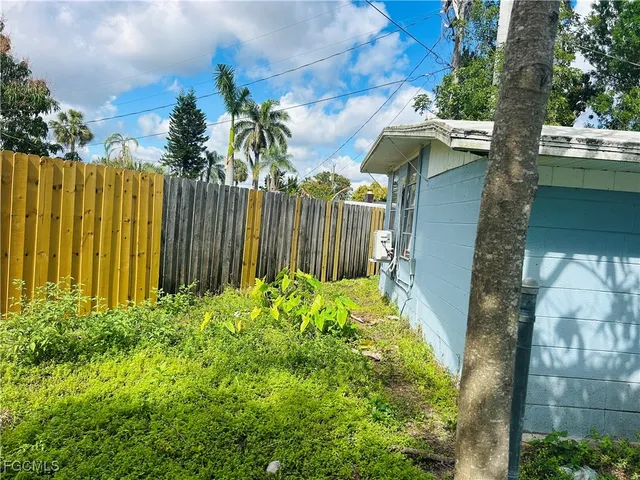 a backyard of a house with lots of green space