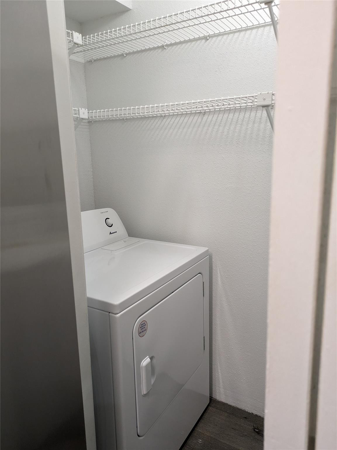 949 Riverside Drive, Unit 411 Coral Springs, FL 33071 - Photo 11 of 15 a utility room with dryer and washer