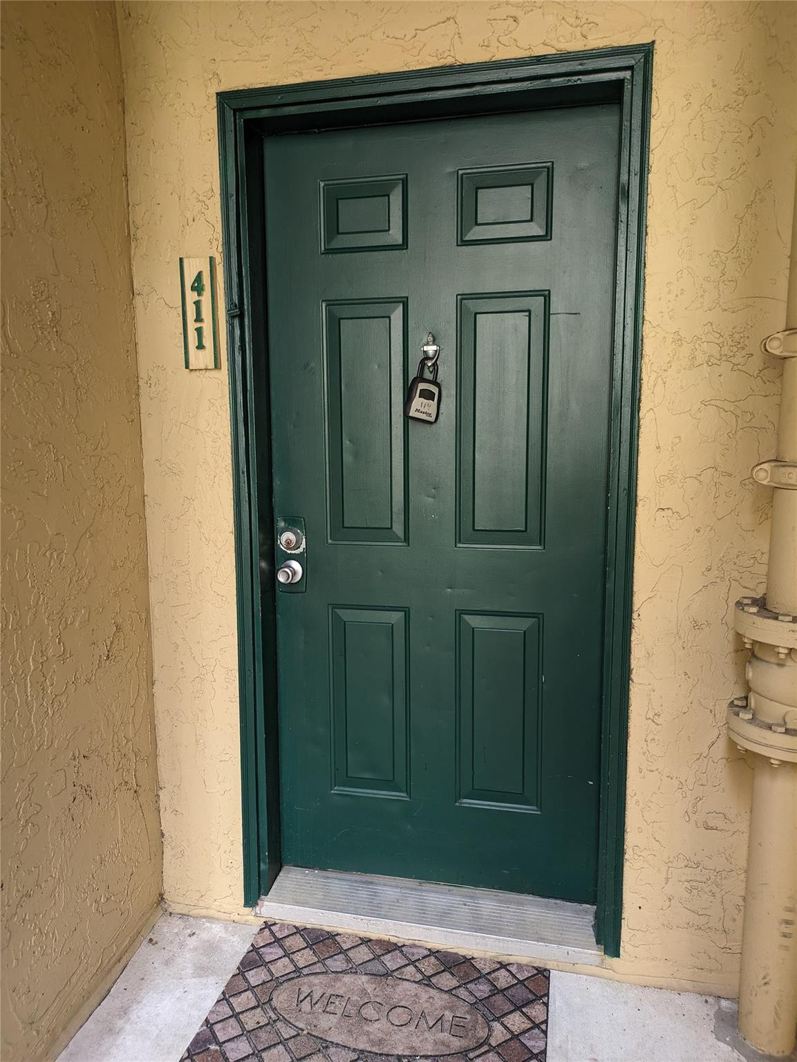 949 Riverside Drive, Unit 411 Coral Springs, FL 33071 - Photo 13 of 15 a view of a wooden door