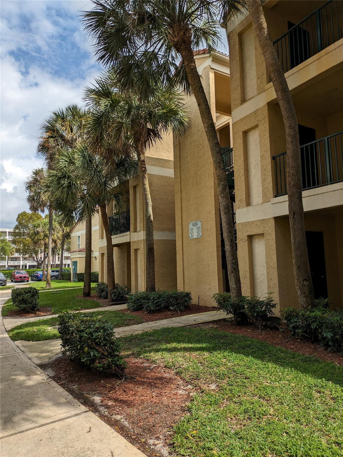 949 Riverside Drive, Unit 411 Coral Springs, FL 33071 - Photo 15 of 15 front view of house with a yard