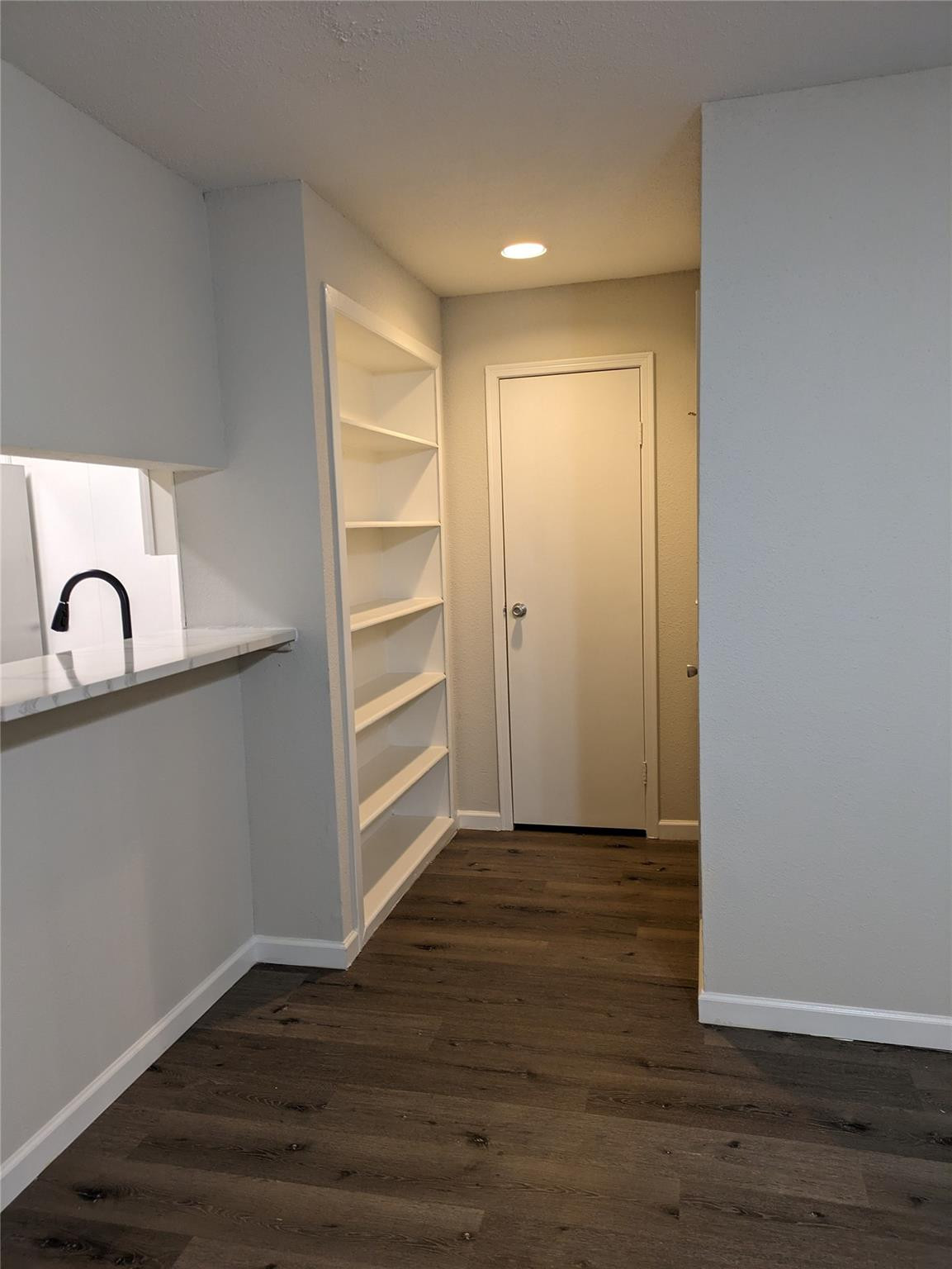 949 Riverside Drive, Unit 411 Coral Springs, FL 33071 - Photo 2 of 15 a view of a room with wooden floor