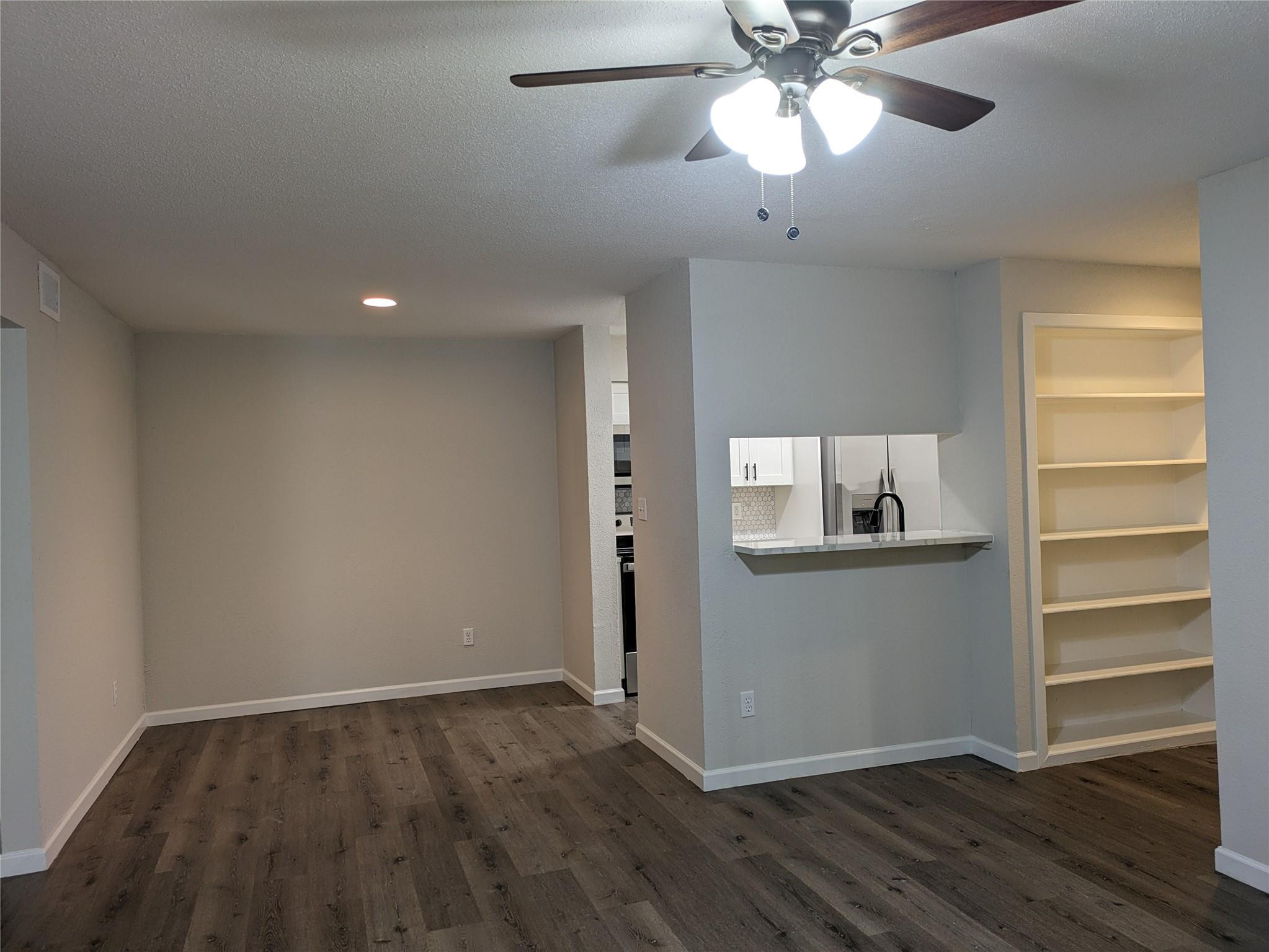 949 Riverside Drive, Unit 411 Coral Springs, FL 33071 - Photo 3 of 15 a view of kitchen and wooden floor