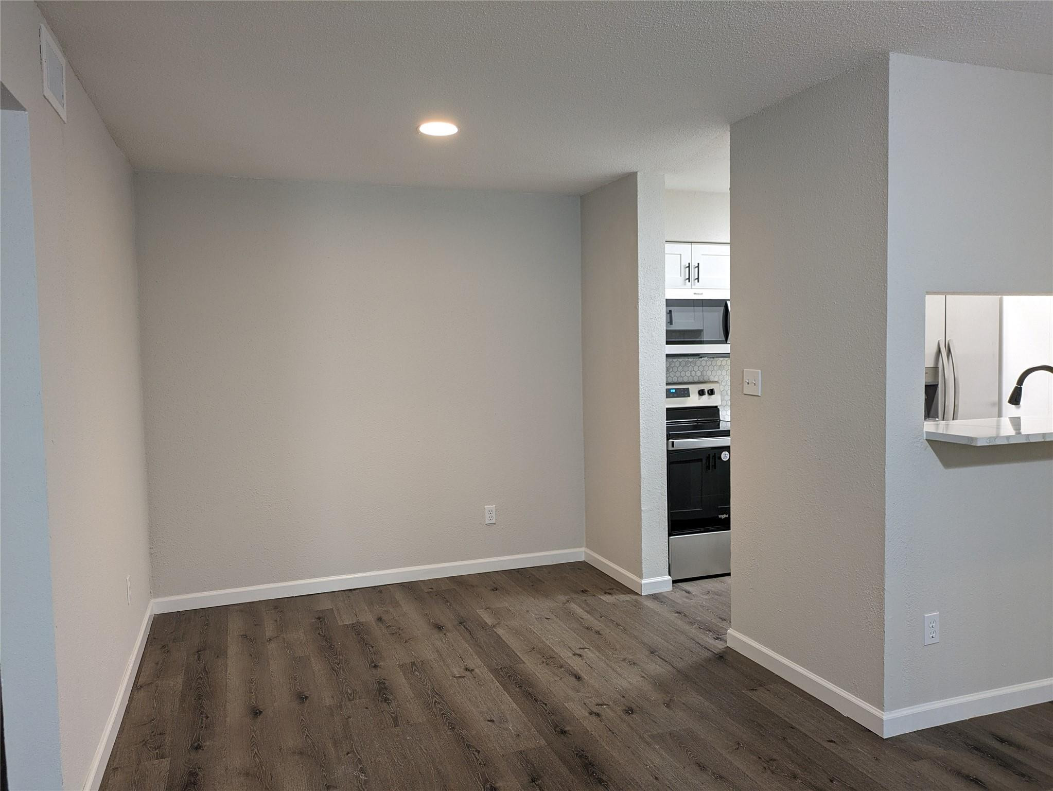 949 Riverside Drive, Unit 411 Coral Springs, FL 33071 - Photo 4 of 15 wooden floor in an empty room