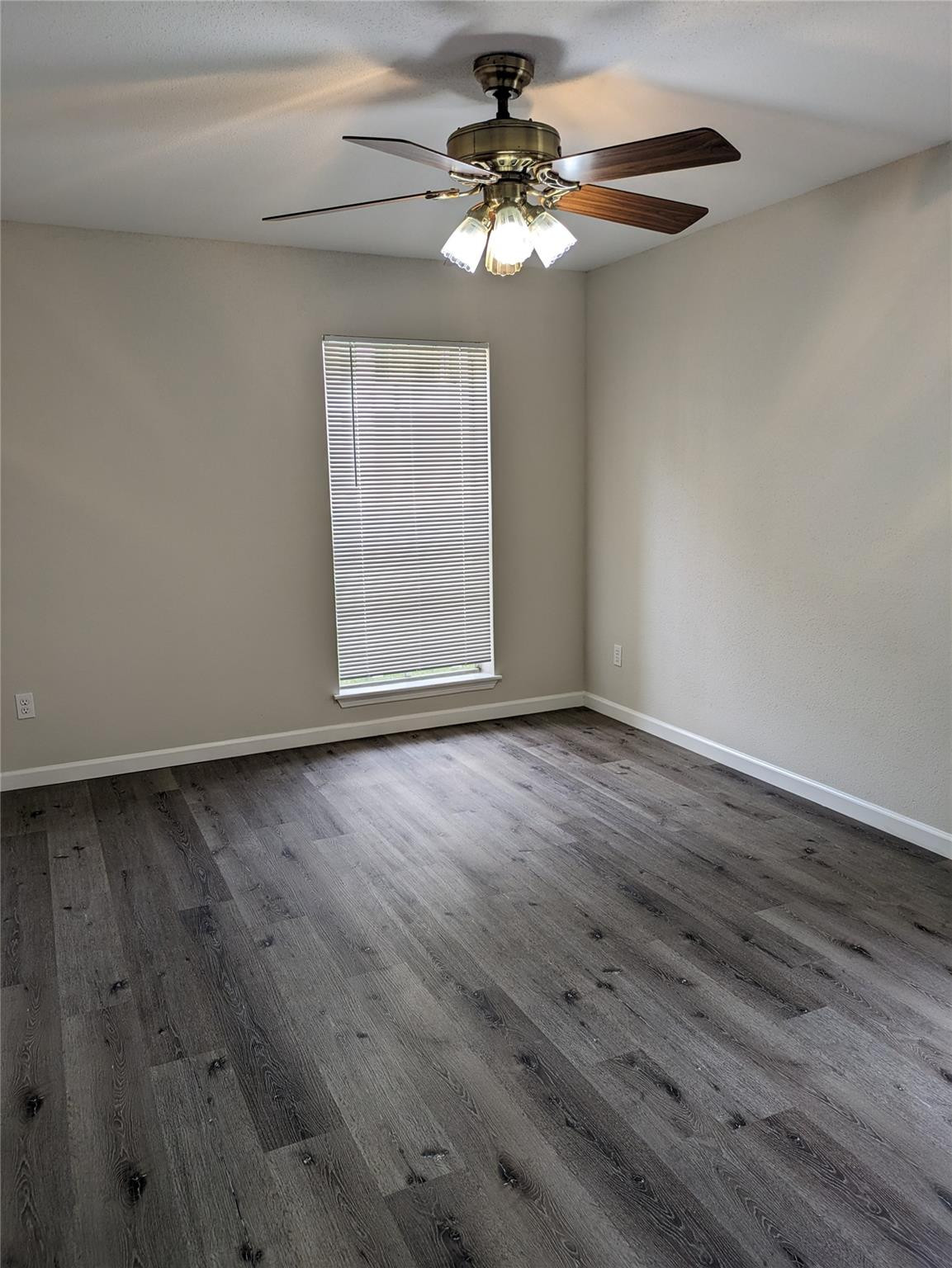 949 Riverside Drive, Unit 411 Coral Springs, FL 33071 - Photo 7 of 15 a view of an empty room with a window