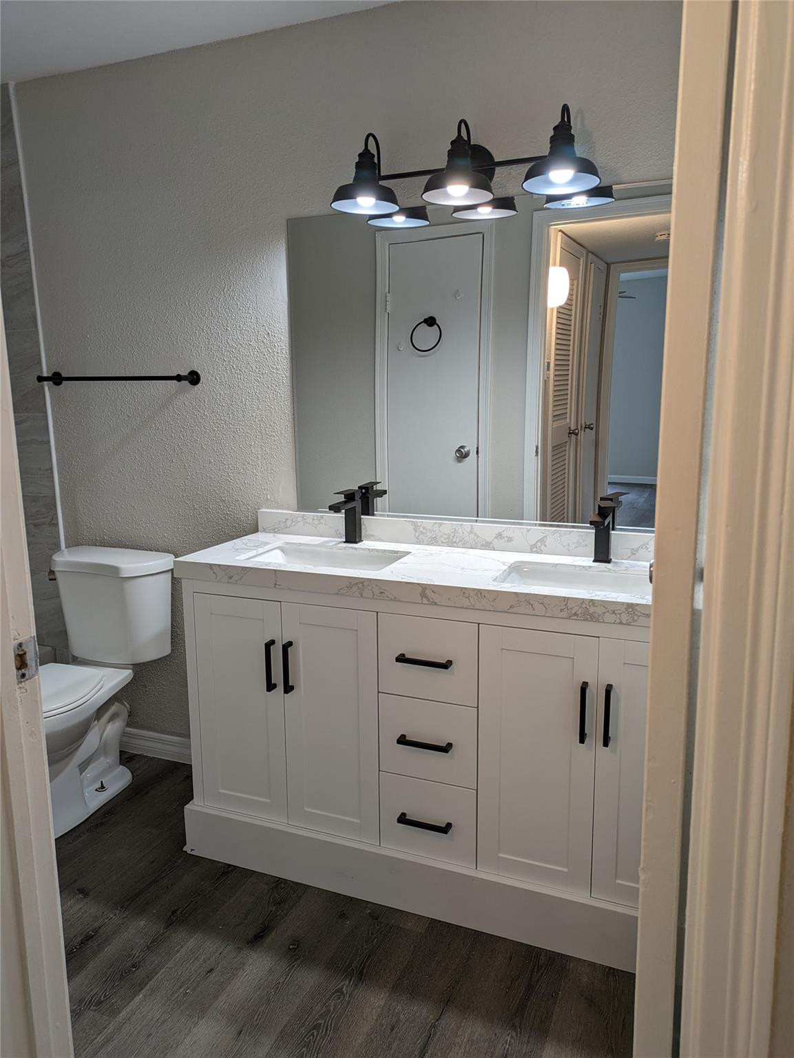 949 Riverside Drive, Unit 411 Coral Springs, FL 33071 - Photo 9 of 15 a bathroom with a sink and a toilet