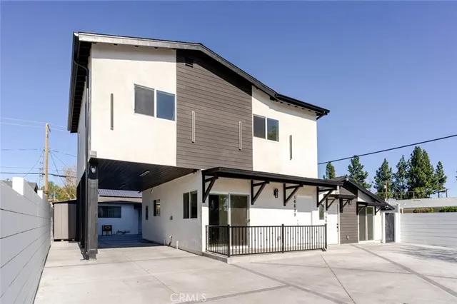 a front view of a house with garage