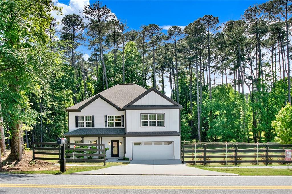 407 Corinth Church Road Winder, GA 30680 - Photo 2 of 66 a front view of a house with a yard