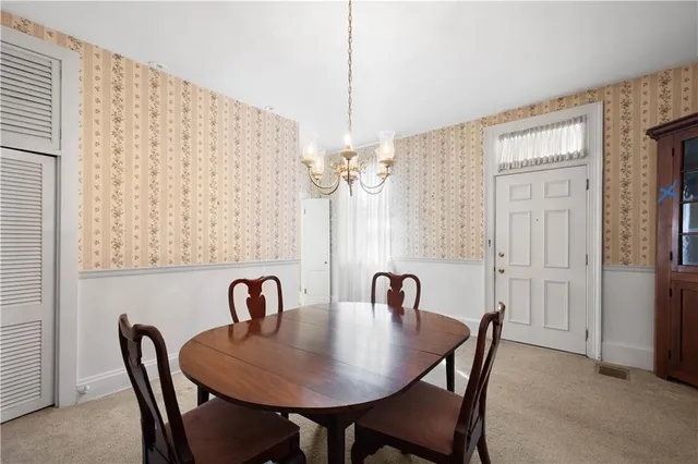 a view of livingroom with window fireplace and cabinet