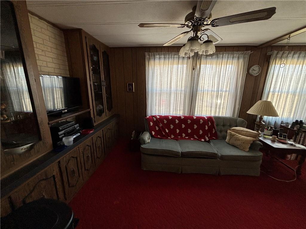 2113 Sebring Road Marion Center, PA 15759 - Photo 2 of 9 a living room with furniture and a flat screen tv
