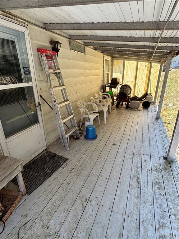 2113 Sebring Road Marion Center, PA 15759 - Photo 8 of 9 a view of a balcony with chairs and wooden floor
