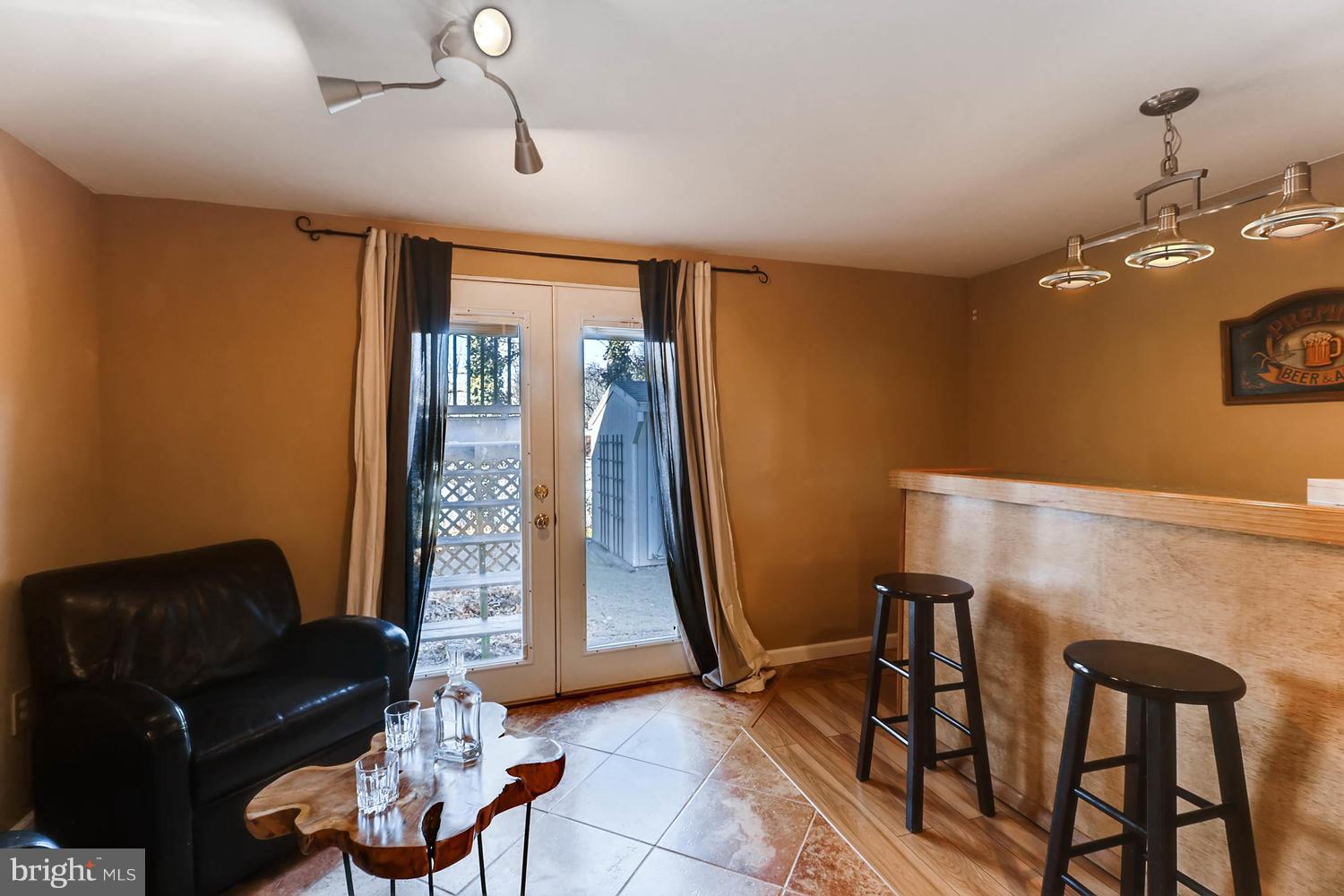 44 Trailwood Road Baltimore, MD 21236 - Photo 22 of 28 Bar/sitting area in basement open to rear yard