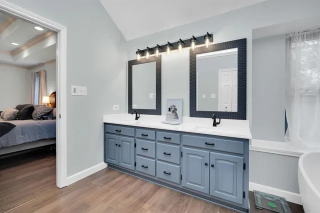 a en suite bathroom with double sink and a mirror