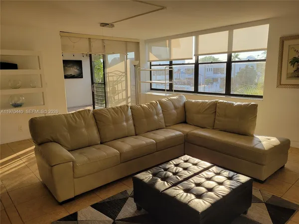 a living room with furniture and a window
