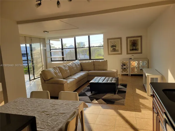 a living room with furniture and a table